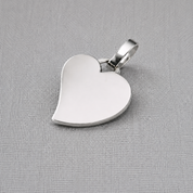 Personalised recycled silver heart pendant with polished finish on fabric