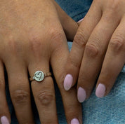 Personalised silver heart ring worn on finger
