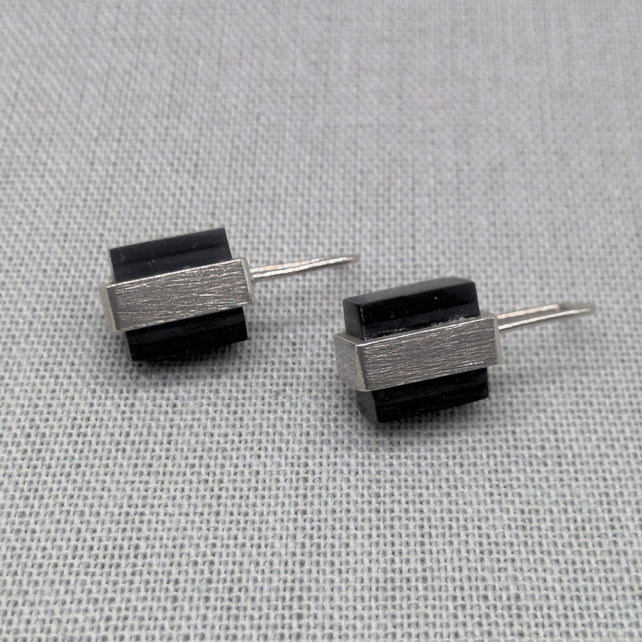 Side by side view of Perspex and silver block earrings