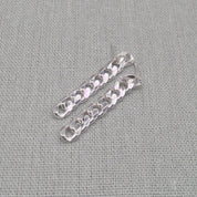 Angled view of silver-tone chunky chain earrings in recycled 925 silver