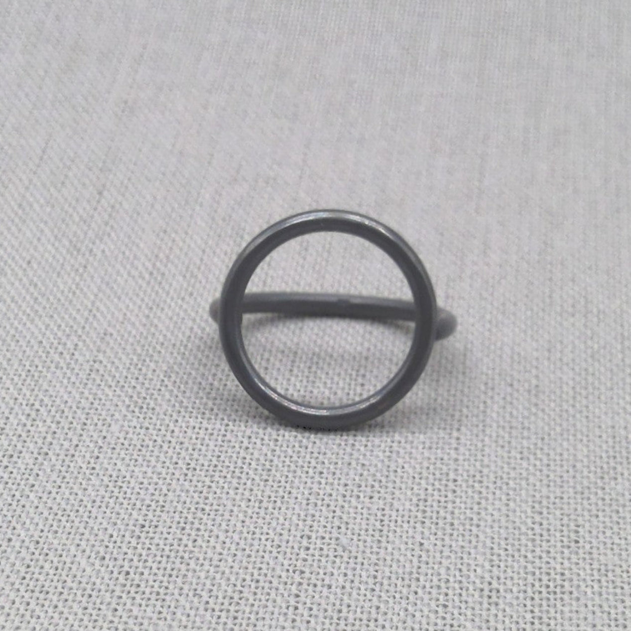 Sculptural circle recycled silver ring in black oxidised finish, full view