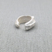 Alternate side view of textured recycled silver ear cuff