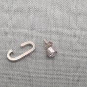 Side view of recycled silver cuff and zircon stud earring set