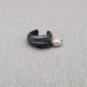 Side view of oxidized silver ear cuff with pearl detail