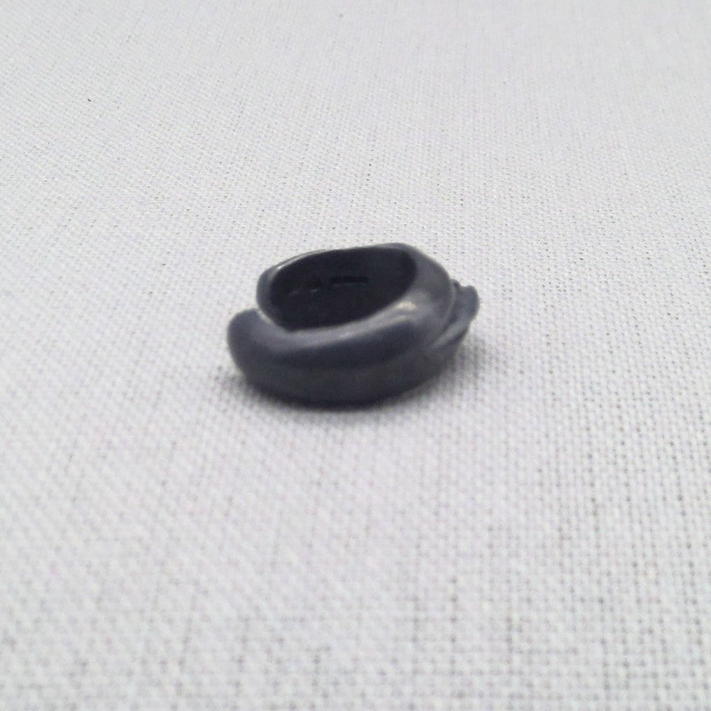 Top-down view of oxidized silver ear cuff showing cuff shape