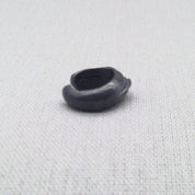 Top-down view of oxidized silver ear cuff showing cuff shape