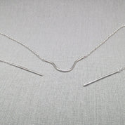 Recycled silver face chain laid flat showing draped chain shape
