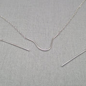 Close-up of rod detail on recycled silver face chain