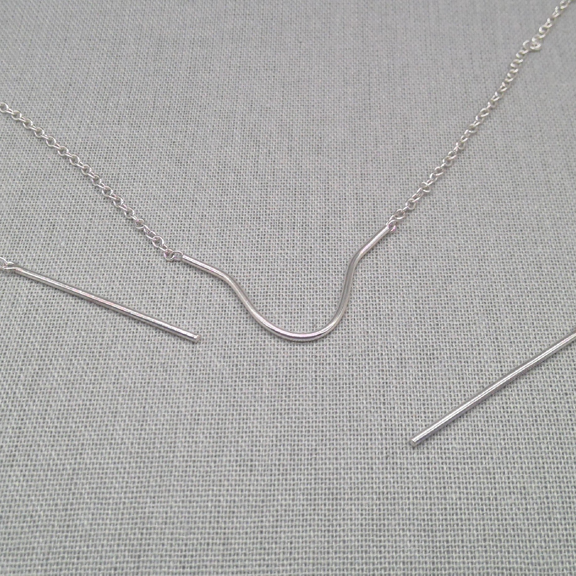 Close-up of rod detail on recycled silver face chain