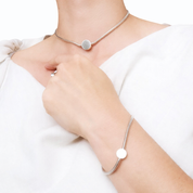 Model wearing matching silver snake choker and bracelet set