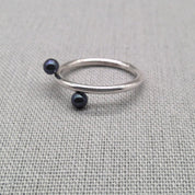 Close-up of pearl and bead detail on recycled silver wrap ring