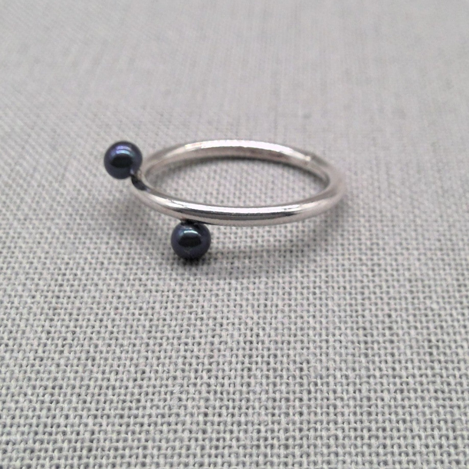 Close-up of pearl and bead detail on recycled silver wrap ring