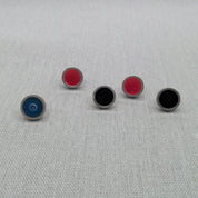 Range of single resin recycled silver studs in blue, black, and red