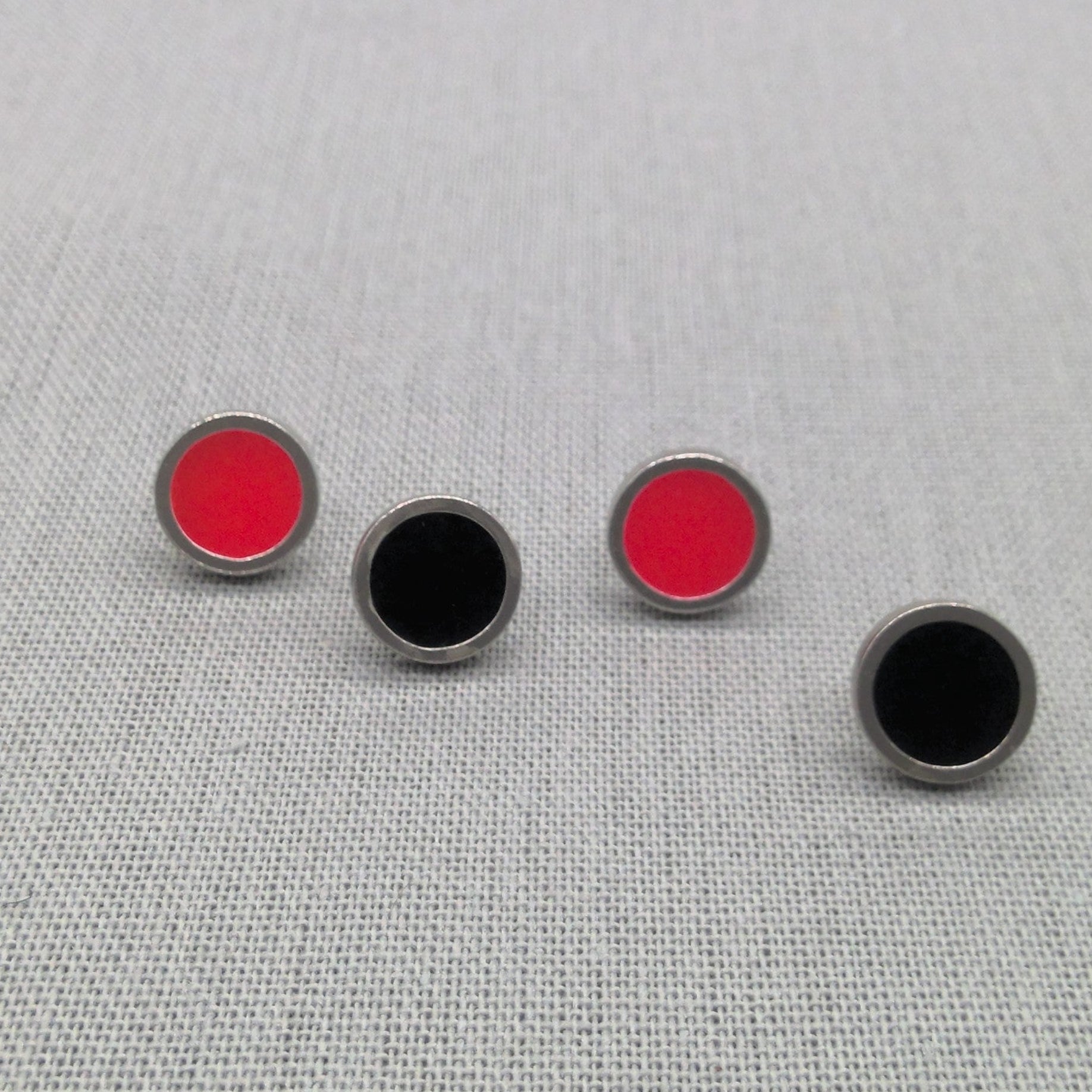Pairs of red and black resin recycled silver stud earrings