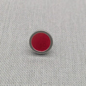 Close-up of red resin recycled silver stud earring
