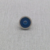Close-up of blue resin and zircon recycled silver stud earring