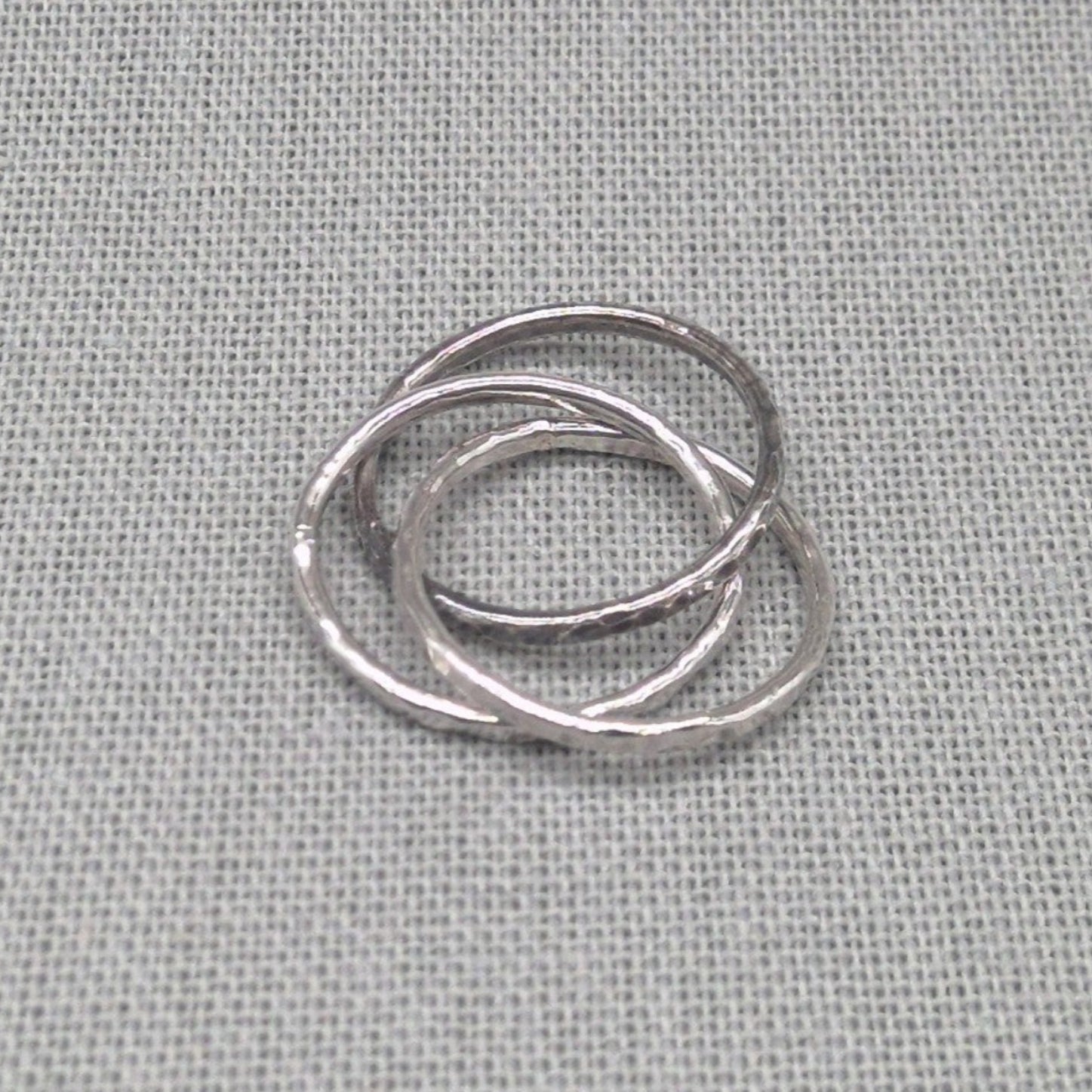 Triple band hammered recycled silver ring, interlocking design, full view
