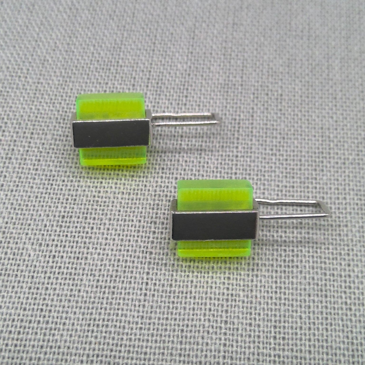 Side view of two-tone neon Perspex stud earrings