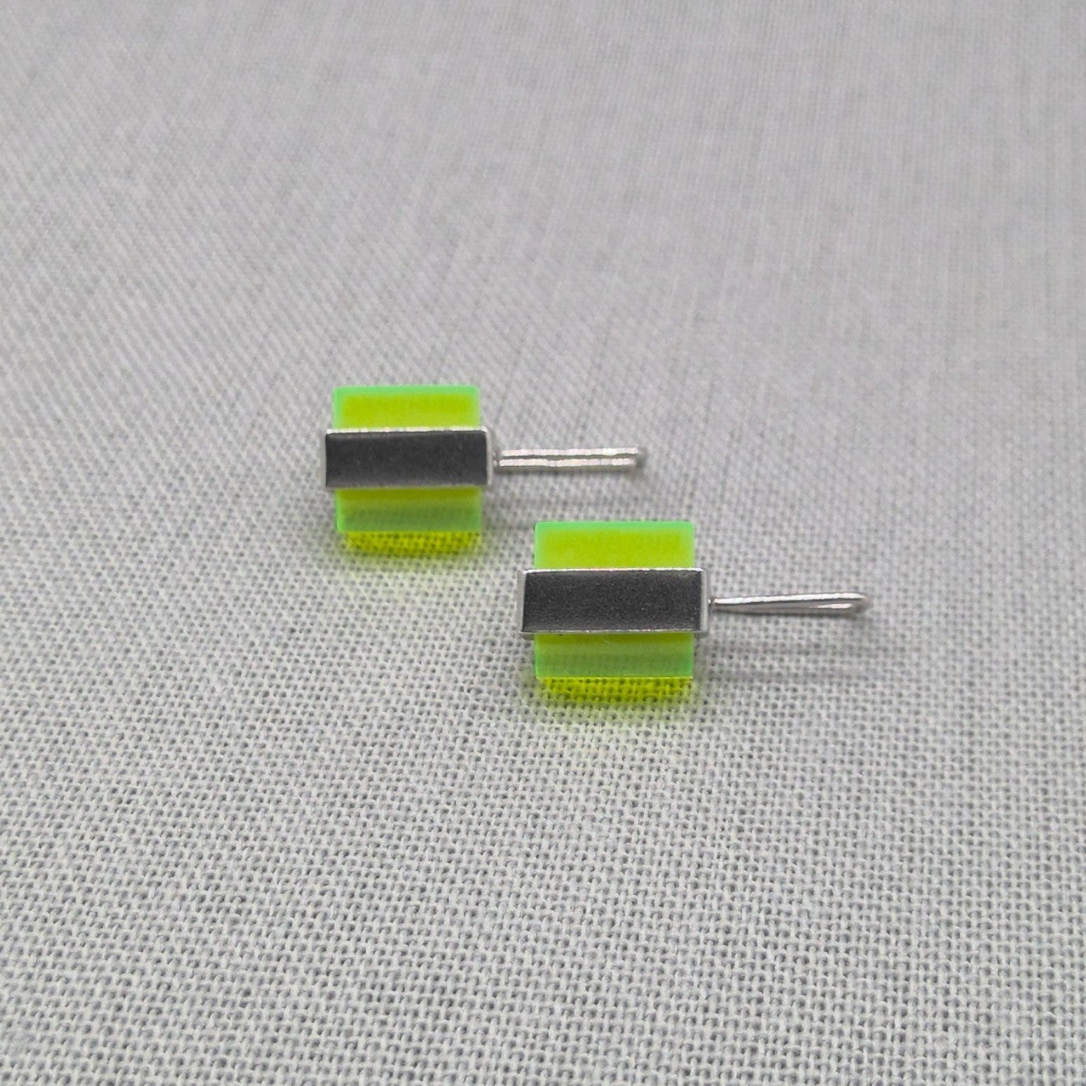 Two-tone neon Perspex recycled silver stud earrings, full pair view